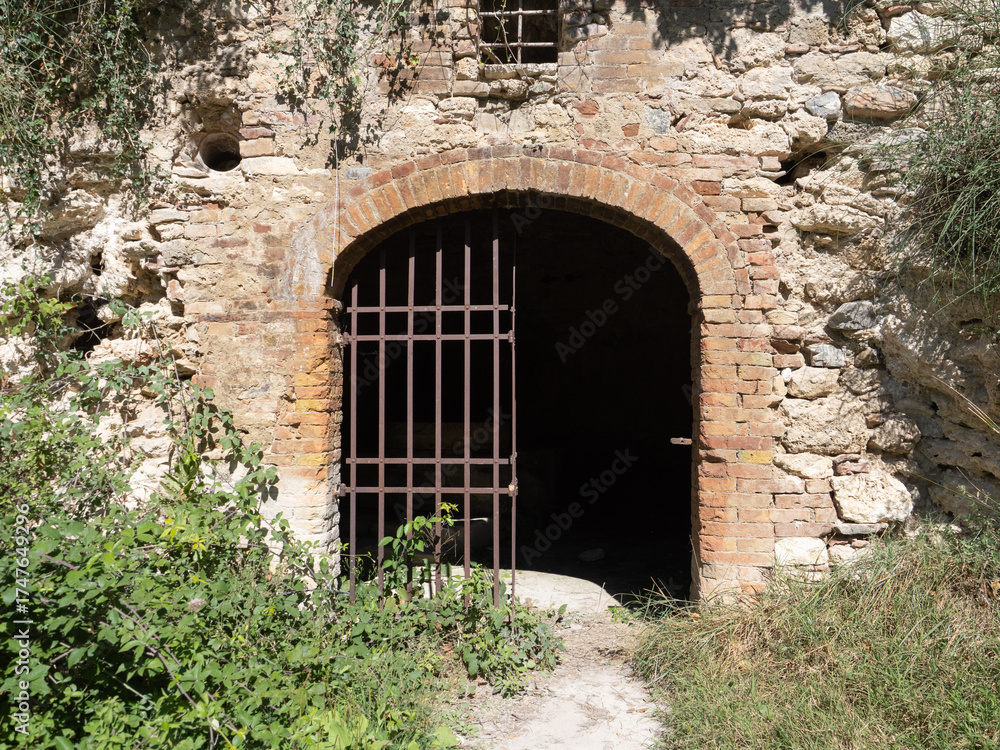Fototapeta premium Parco naturale dei Mulini, public park with hot springs and dismantled system of grain mills at Bagno Vignoni, town in the province of Siena, Italy