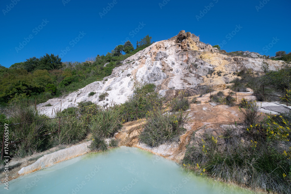 Obraz premium Parco naturale dei Mulini, public park with hot springs and dismantled system of grain mills at Bagno Vignoni, town in the province of Siena, Italy