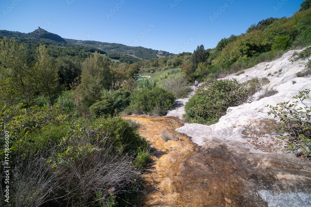 Obraz premium Parco naturale dei Mulini, public park with hot springs and dismantled system of grain mills at Bagno Vignoni, town in the province of Siena, Italy