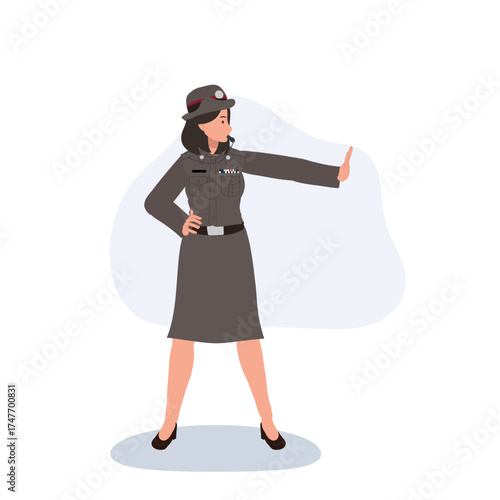 asian policewoman in official uniform stopping traffic and representing law enforcement authority and safety management