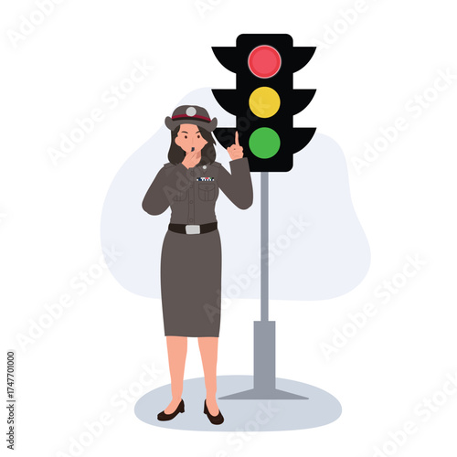 traffic control by female officer beside red light emphasizing discipline and transportation safety