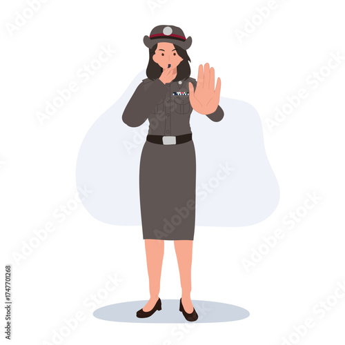 a female police officer in thailand uniform signaling stop hand gesture during traffic control representing law and order