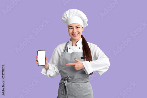 Young female chef pointing ...