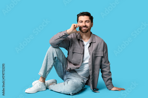 Young man talking by modern...
