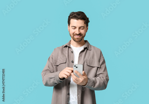 Young man with modern mobil...