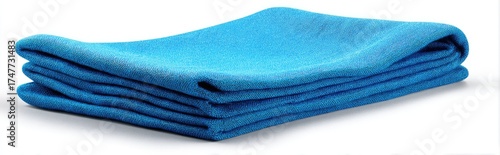Folded turquoise blanket against white background