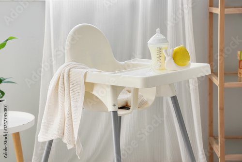 Baby highchair with bottle ...