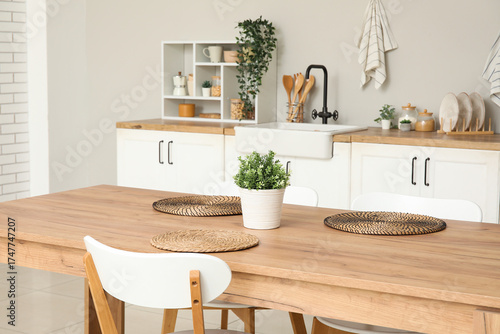 Wooden dining table with ho...