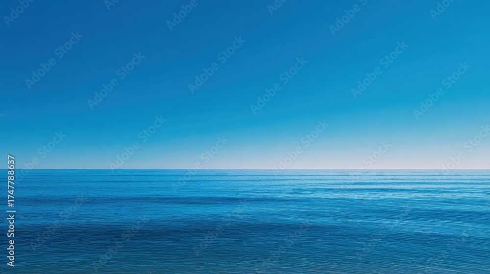 Obraz premium Serene Ocean Horizon Under Clear Blue Sky on a Calm Day