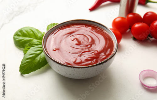 Fresh tomato ketchup in cer...