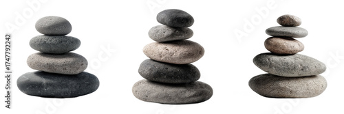 Three separate cairns composed of smooth gray and dark river rocks balanced perfectly