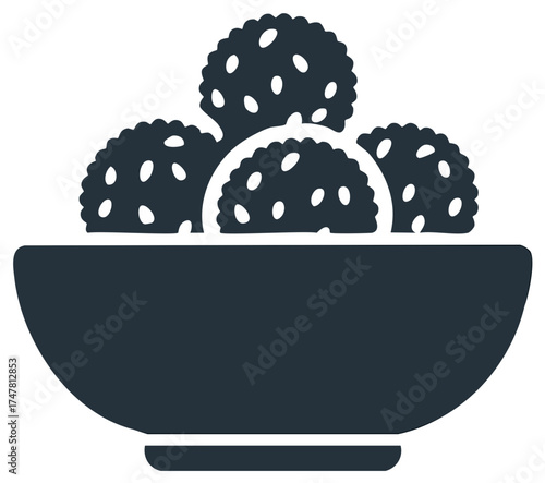 Bowl of savory or sweet snack balls with textured surface icon