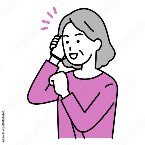 スマートフォンでの通話で喜ぶ年配の女性
