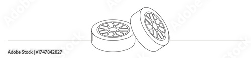 Line art of two car tires and rims stacked and lined up with a transparent background. automotive enthusiast concept
