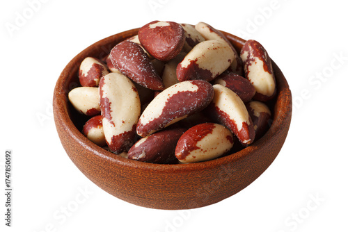 A rustic wooden bowl filled with whole Brazil nuts.