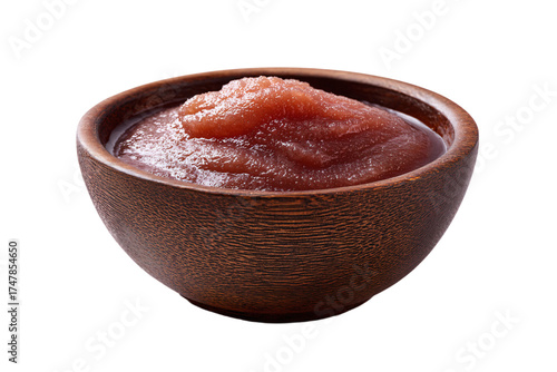 A small rustic brown bowl of fresh homemade applesauce.