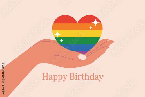 A warm and inviting illustration shows a hand holding a rainbow heart, representing inclusivity and love, with 'Happy Birthday' text for joyful celebrations.