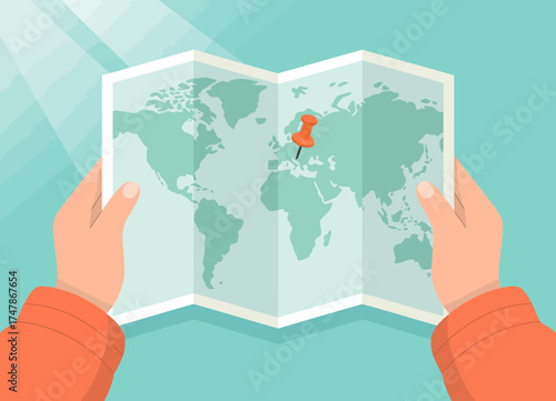 A visually appealing image depicting hands holding a folded world map, representing exploration and the anticipation of travel adventures globally.