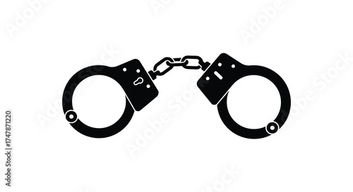 Symbolic metallic handcuffs representing arrest justice law enforcement crime detention security freedom silhouette