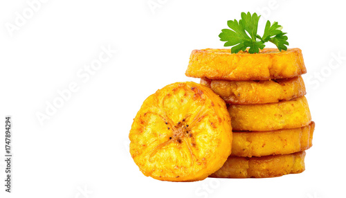 Stacked fried plantain slices, golden-brown, with parsley garnish, on black background