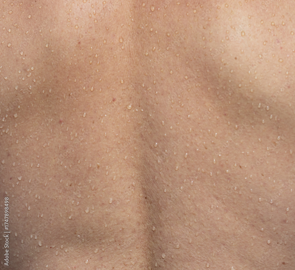 Fototapeta premium A man's back is wet with sweat