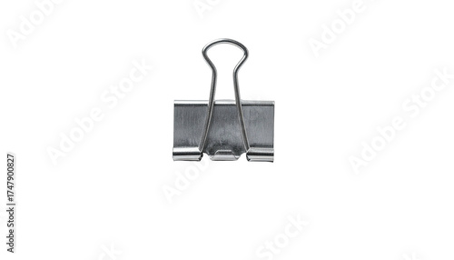 Silver metal binder clip, centered against a stark black background