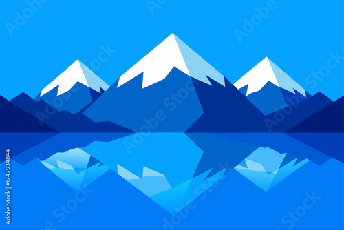 Mountains reflected in water with a blue color cast