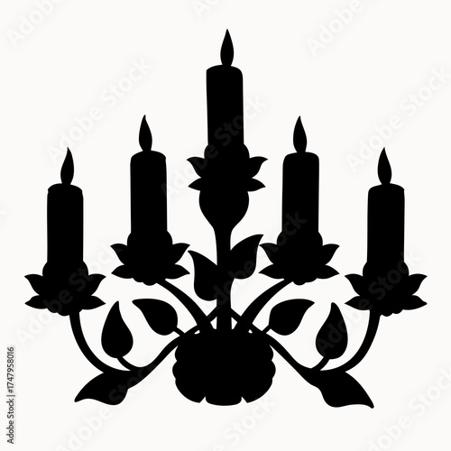 Silhouette of candelabra with five candles and floral design elements in a black and white image