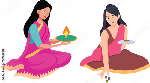 Two Indian women in traditional saree lighting oil lamps during festival celebration.