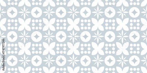 Seamless pattern of white geometric floral motifs on a light blue textured background