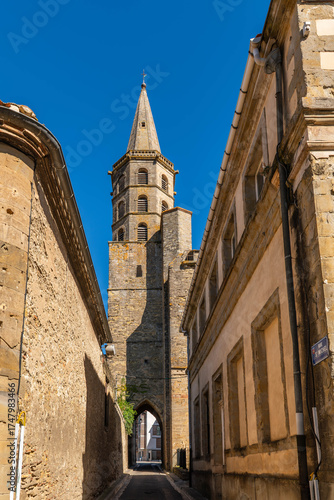 Rue Saint Michel and the bell tower and door of the Saint Michel church, in Castelnaudary, in Aude, in Occitanie, France