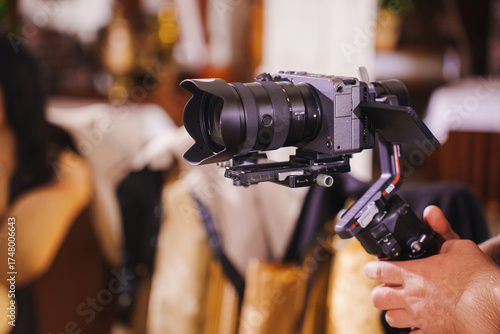 Professional camera setup for videography in a lively restaurant setting