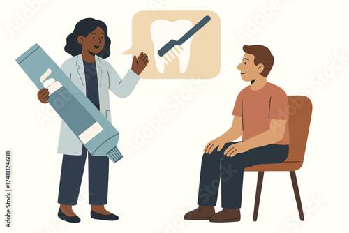 African female dentist advising young caucasian male on oral hygiene with toothpaste and brush