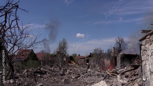 Wallpaper Mural Destroyed houses, burnt trees in the village after shelling, fire can be seen on the site of the former house. One of the houses on the street burns out. Villages and cities were destroyed during Torontodigital.ca