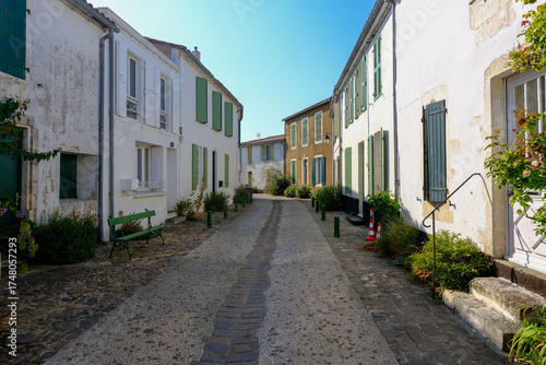 Fototapeta Naklejka Na Ścianę i Meble -  The quaint rural village streets of La Flotte, showing old houses and winding lanes