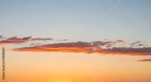 Blurry seascape with warm tones and distant horizon during sunset