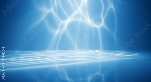Abstract blue light rays shining down on a reflective surface