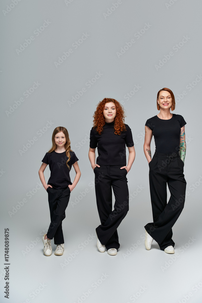 Obraz premium Three generations of red haired women enjoying autumn together in casual black attire