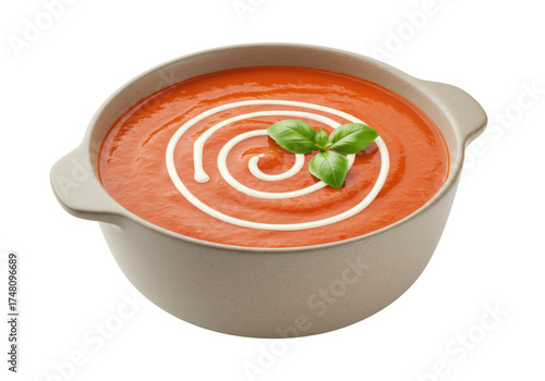 Fotografie Isolated bowl of tomato soup with cream swirl and basil garnish on a neutral set