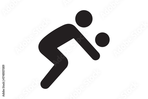 Silhouette depicts a person bending over while holding and observing a ball closely