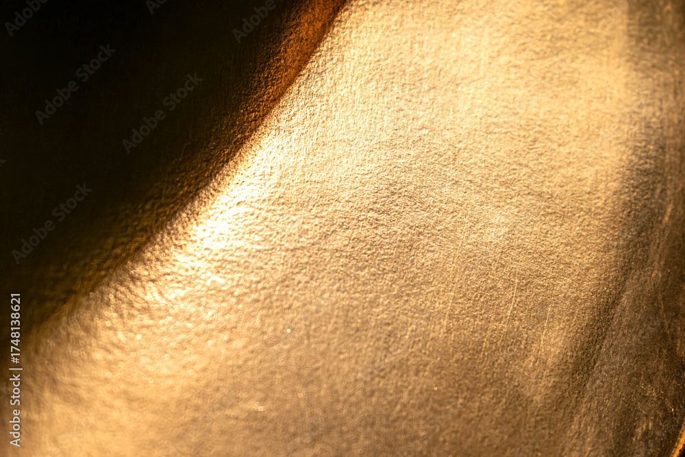 Fototapeta premium Golden background of an authentic image of an object, zoom on its texture for background and concept