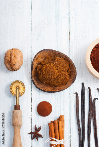 dessert ingredients and kitchen utensils on old white wooden table