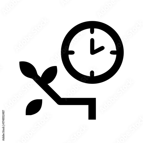 Clock with plant representing time and growth metaphor