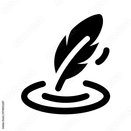 Feather quill pen with ink drop