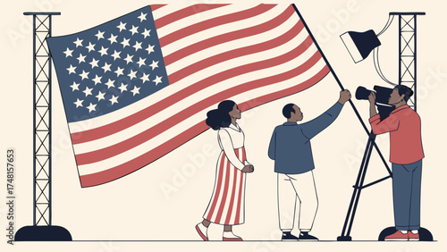 A large flag being photographed by a person with a camera with two other people standing nearby.