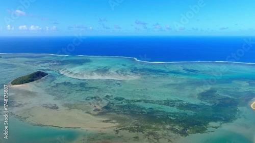Aerial view of Mauritius island and Le Morne Brabant mountain with beautiful blue lagoon and underwater waterfall illusion background	