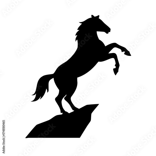 Black silhouette of a horse rearing on a rock