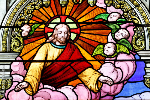 Saint Jacques church.  Stained glass. Jesus with angels.  Angers. France.