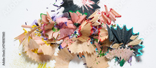 Tableau sur toile Multicolored pencil shavings and small sawdust lying in a haphazard heap on a white background