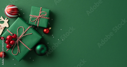 Obraz na plátně Christmas gift green poster background presents twine red ornaments festive holi